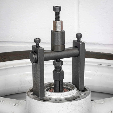 10pc Bridge Bearing Puller Set installed on machinery, demonstrating bearing removal process with screw-type extractor and collet grips