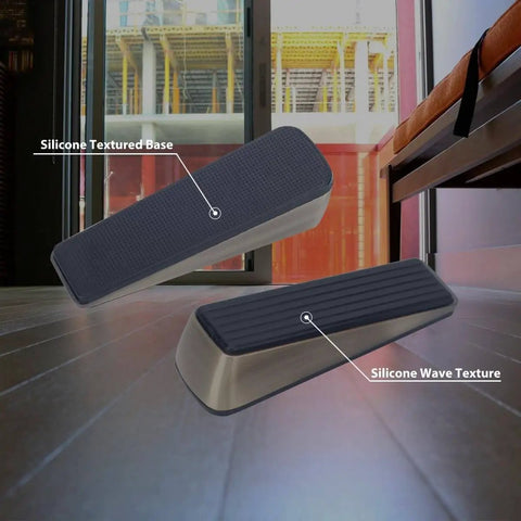 Antique Bronze Heavy Duty Door Wedge With Anti Slip Rubber Base Keeps Bottom Of Door Open And Prevents Slams Includes Silencer Pads To Protect Walls 2 Pack Door Stopper For Floor Protection And Quiet Stays Put shown on floor.