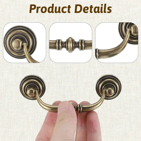 Close-up of Two Bronze Vintage Drop Bail Drawer Pulls With 3.5 Inch Center Spacing And 4.5 Inch Total Length in hand view