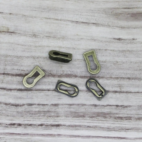 5 Pack Zinc Alloy Keyhole Covers in Bronze Tone for Dresser Furniture Lock Decoration Cabinets and Desks, 18x8mm size, top view.
