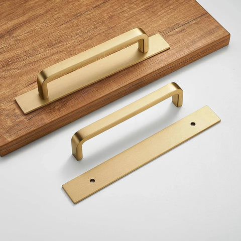 Solid Brass Cabinet Pull With Backplate Set Of 2 in Brushed Gold Finish with one installed on wood surface, modern 5 inch handles
