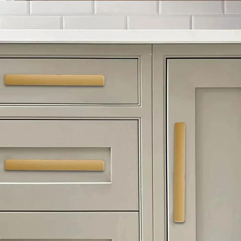 Brushed Gold Cabinet Pulls 4 Inch 2 Pack Solid Zinc Alloy Drawer Handles installed on gray kitchen cabinets