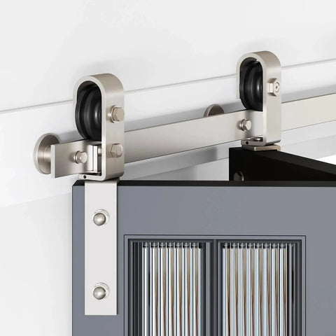 Close-up of 28 Inch Brushed Nickel Bifold Sliding Barn Door Hardware Track Kit With Side Mounted J Shape Rollers, installed view.