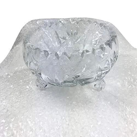 Crystal bowl wrapped in Bubble Cushioning Wrap For Fragile Items Perforated 12 Inch Roll 175 Ft Clear With Small Three Sixteenth Inch Bubbles