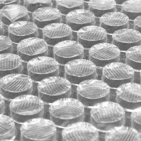 Close-up of clear bubble texture from 2 Pack 12 Inch Bubble Packing Wrap 72 Feet Perforated Every 12 Inches for Moving Boxes and Shipping Cushioning.