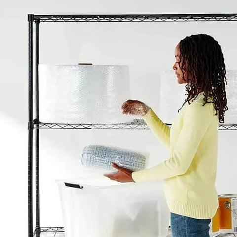 Person holding Bubble Cushioning Wrap For Fragile Items Perforated 12 Inch Roll 175 Ft Clear With Small Three Sixteenth Inch Bubbles
