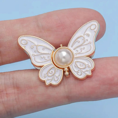 Close-up of single butterfly button from 8 Piece Butterfly Jeans Button Waist Tighteners Set With Detachable Clips Adjustable Waist