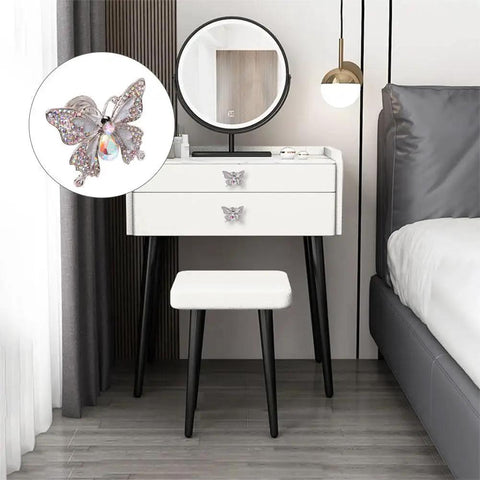 Butterfly Rhinestone Cabinet Knob Set 4 Piece Zinc Alloy Silvery Single Hole Pull Handles on white dresser close-up.
