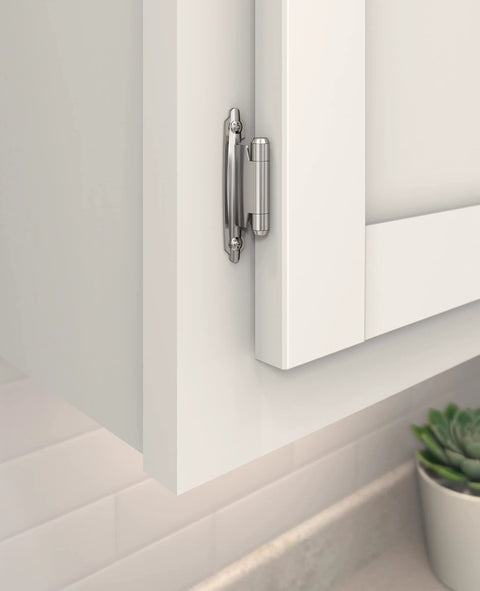 Close-up of ✝️ 2-Pack Cabinet Hinge Variable Overlay 𝐇inge Polished Chrome 2 Pack Self-Closing 𝖧inge Face Mount Ｈinge on white cabinet door.