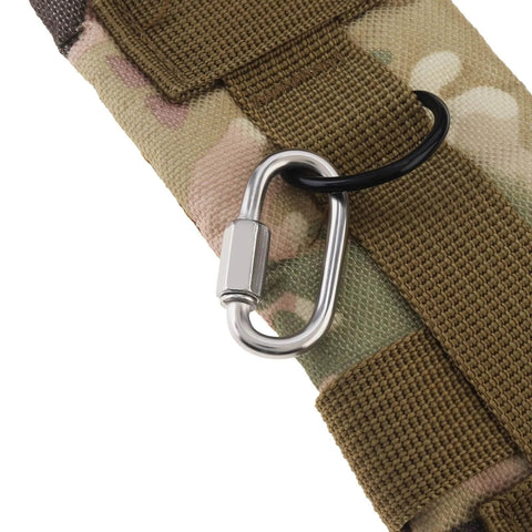 Close-up of a carabiner attached to a camouflage fabric strap
