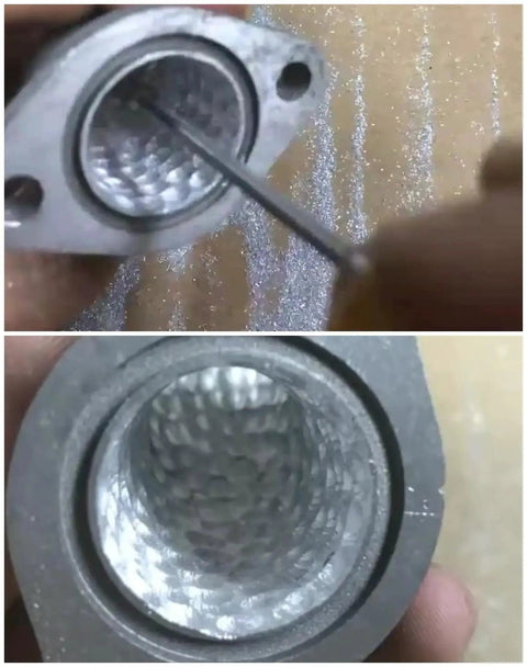 Using the long carbide burr set for die grinder to smooth an exhaust manifold, demonstrating precision grinding in tight spaces.