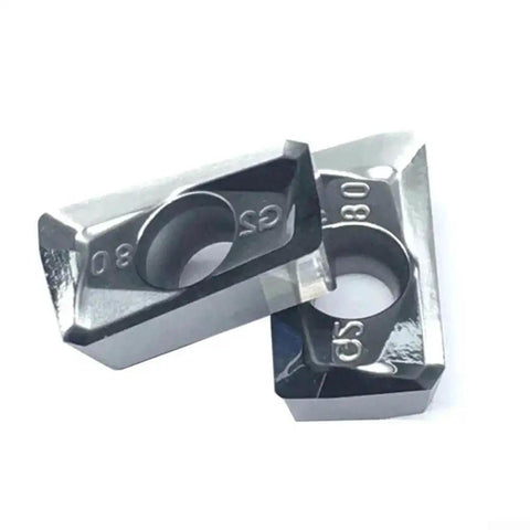 Close-up of two carbide milling inserts from the 10 Pack APKT1604PDFRG2 Carbide Milling Inserts for Aluminum Finishing and Semi Finishing.