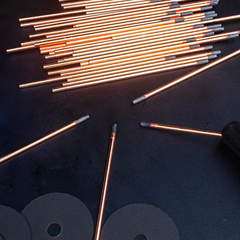 Carbon Arc Gouging Rods Set 10 Pcs 6mm X 305mm Copper Graphite Coated Welding Electrodes on dark surface