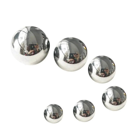 Various sizes of Carbon Steel Bearing Balls on white background, showcasing Precision Balls from 9mm to 20mm, used for high-strength applications.