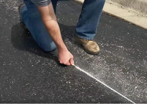 Person using Two Pack P100 Octagonal Chalk Line Reels 100 Foot Length 1.5mm String for precise layout on pavement
