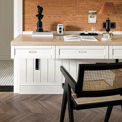Dining area with light wood desk, cane chair, desk decor, and 10 Pack 3.75 Inch Champagne Bronze Cabinet Handles made from solid zinc alloy.