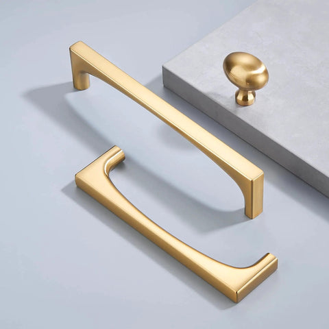 Champagne Bronze Oval Cabinet Knobs 10 Pack Single Hole Cabinet Pulls with rectangular handles on a light surface