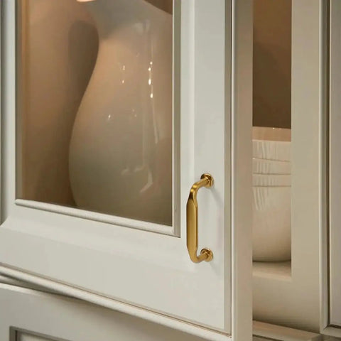 Close-up of cabinet door with Six Pack Champagne Bronze Cabinet Pulls 3 Inch Hole Center Solid Zinc Alloy Dresser Drawer Handles.