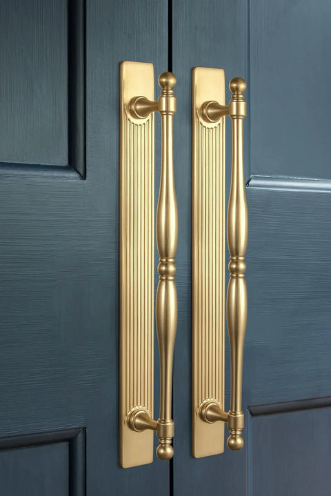 Champagne Bronze Cabinet Pulls With Backplates Modern Zinc Alloy Drawer Handles installed on blue cabinet doors