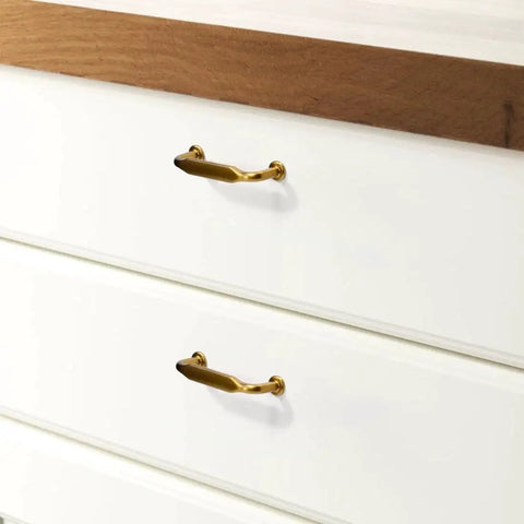 10 Pack Champagne Bronze Cabinet Pulls 3 Inch Center Hole Solid Zinc Alloy Dresser Handles Dark Gold Honey Bronze on white drawers
