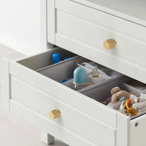 Champagne Bronze Zinc Alloy Knurled Dresser Knobs on a white dresser drawer, showcasing durable solid knob handles for cabinets and drawers.