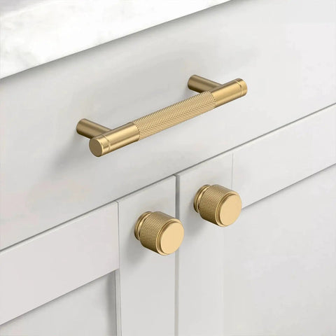 Champagne Bronze Zinc Alloy Knurled Dresser Knobs 20 Pack Cabinet Hardware installed on white cabinets and drawers.