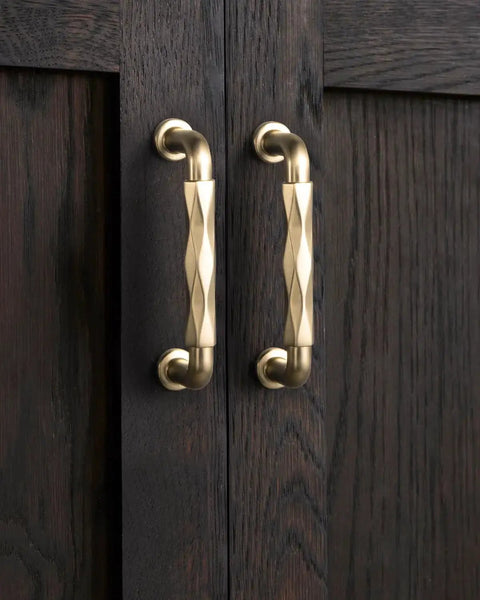 Champagne Bronze Cabinet Pulls 3 Inch Twisted Wave Design Set of 6 Zinc Alloy Drawer Handles mounted on dark wood cabinet