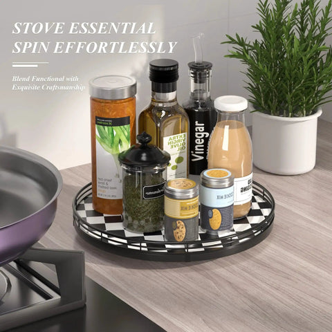 12 Inch Round Black And White Checkered Lazy Susan Turntable With Iron Frame on a kitchen counter with condiments and jars.