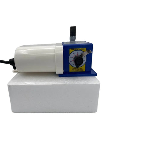 Front view of Precision Controls - Chem Flow Diaphragm Pump, 30 GPD Max, 100 PSI, 230 Volt Metering Pump on display block
