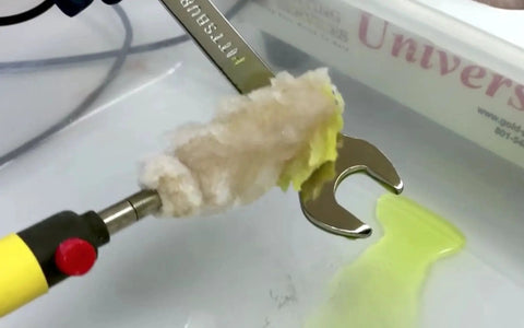 Chrome Plating Kit With Brush System 24K Gold Solution Three Step Process in use, applying gold on a metal surface in workshop.