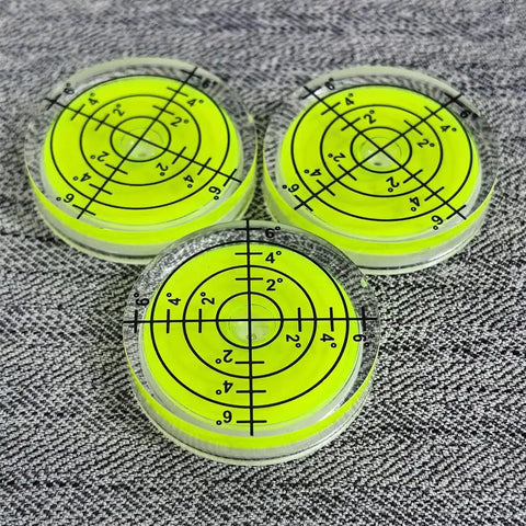 Three Pack Small Circular Bubble Levels 32x7mm Acrylic Round Spirit Level For Layout Tools on grey fabric