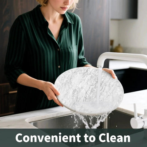 Person washing 10 Inch Marble Lazy Susan with silent rotation for countertop kitchen organization, showing natural marble texture.