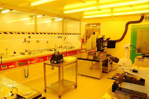 Interior of a cleanroom with workstations and equipment, showcasing environment suitable for Conductive ESD Trash Can For Cleanrooms.