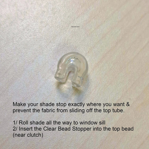Clear bead stopper for shades on wooden surface