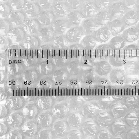 Clear bubble cushioning wrap with ruler, showing small three sixteenth inch bubbles. Bubble Cushioning Wrap For Fragile Items Perforated 12 Inch Roll 175 Ft