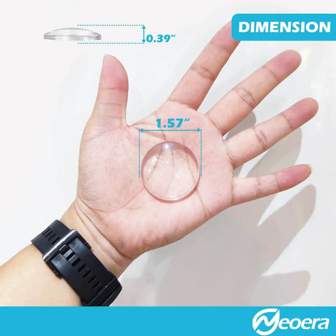 Clear Eight Pack Door Stopper Wall Protector With Adhesive Gel Bumpers in hand, displaying 1.57 inch diameter and 0.39 inch thickness.
