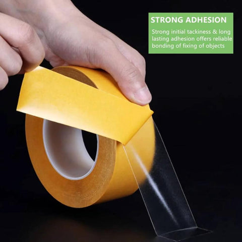 Ultra Thin Clear Double Sided Mounting Tape Heavy Duty 2 Inch By 82 Feet All Purpose Strong Adhesion being peeled from a roll