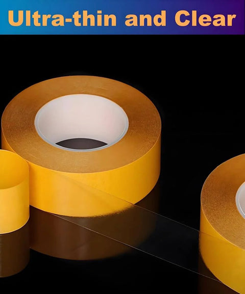 Rolls of Ultra Thin Clear Double Sided Tape For DIY Crafts And Home Projects displayed on a black surface