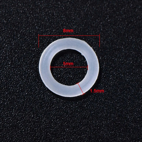 Close-up of a single clear O-ring with 8mm outer, 5mm inner diameter, and 1.5mm thickness for 200 Pieces O Ring Keyboard Dampeners For MX Switches And Mechanical Keys, Clear Rubber Dampeners With Plastic Storage Box, Replacement Dampers For Quiet, Smoother, Quieter Keystrokes, Durable, Easy Install.