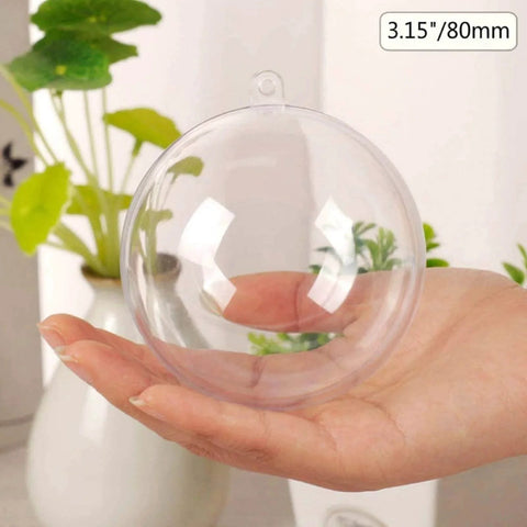 Hand holding a clear plastic ornament ball, 3.15''/80mm, for Christmas, holiday, wedding, party, and home decor DIY crafts.
