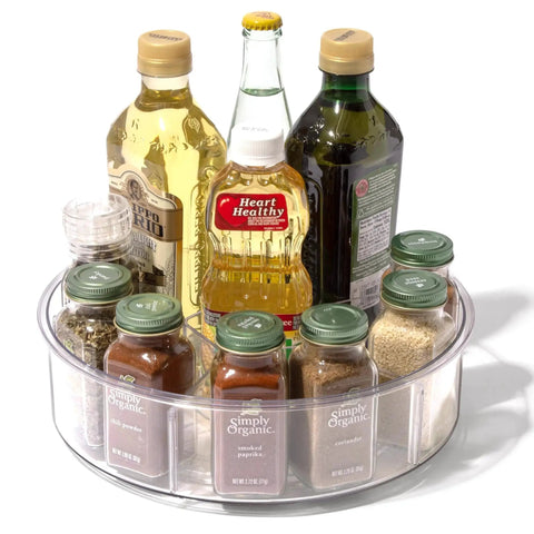 Round Turntable Organizer With Six Removable Clear Bins 11.7 Inch Rotating Storage Tray with spices and condiments on a kitchen counter.