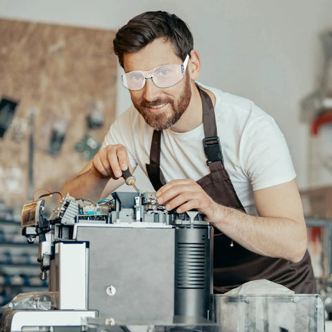 Man wearing Clear Z87.1 Certified Safety Glasses For Work Lab Scratch Resistant 30 Pcs in workshop setting