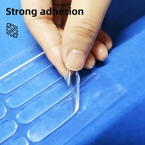 Person peeling Clear Self Adhesive Door Silencers Long Strips Ultra Quiet Rubber Cabinet Bumpers from blue backing sheet.
