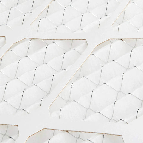 Close-up view of MERV 8 furnace air filter material with electrostatic design, trapping dust, pollen, and lint for allergy relief.