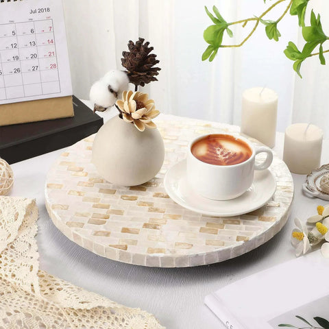 12 inch mother of pearl lazy susan turntable with marble pattern, used for serving coffee on a decorative wooden tray.