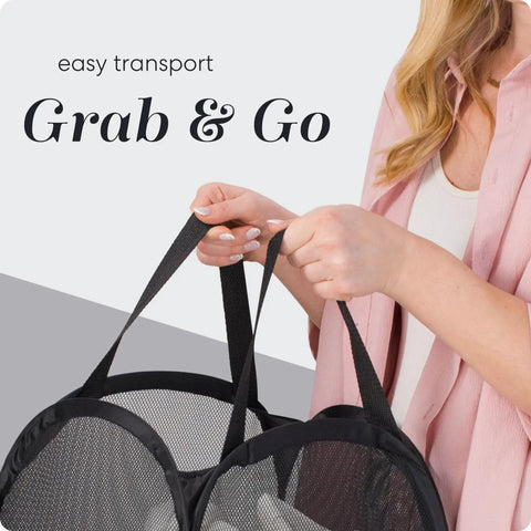 Person holding a Collapsible Mesh Pop Up Hamper With Wide Opening And Side Pocket Breathable Sturdy Foldable Space Saving Design