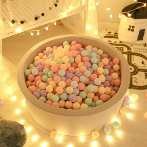 Colorful Ball Pit Balls - Pink Soft Plastic Balls Phthalate Free BPA Free Play Balls for Ball Pool Birhtday Party Girls Kids with Storage Bag, 6Colors,100pcs in a pastel-themed room