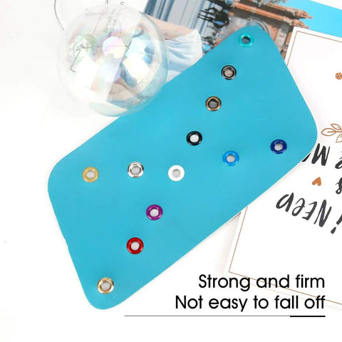 All In One Metal Grommets Kit With 600 Pieces In 12 Colors for DIY, showing copper eyelets on fabric swatch.