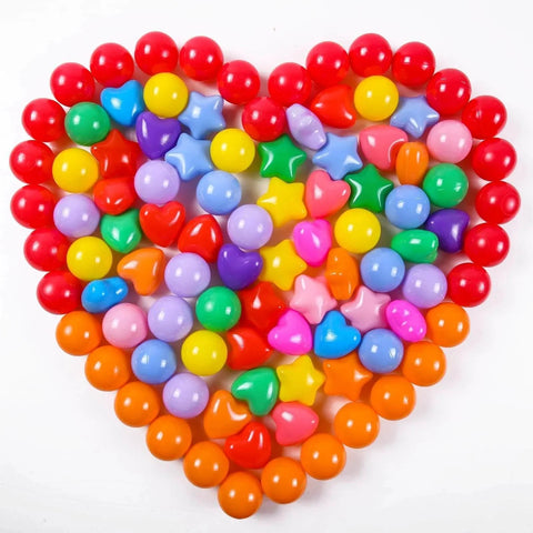 Heart-shaped arrangement of colored balls from Ball Pit Balls Pack of 100 - Phthalate Free BPA Free Crush Proof Plastic Ball, Play Balls for Ball Pit Pool Playpen Babies Kids Children Birthday Parties Pool Tent Party.
