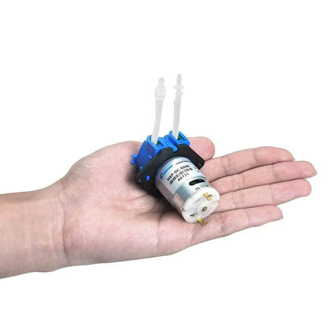 Hand holding low flow peristaltic pump 12V dc DIY liquid small dosing pump for aquarium lab analytical 3mm ID x 5mm OD